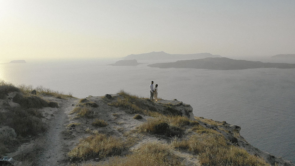 drone sunset santorini engagement wedding videographer