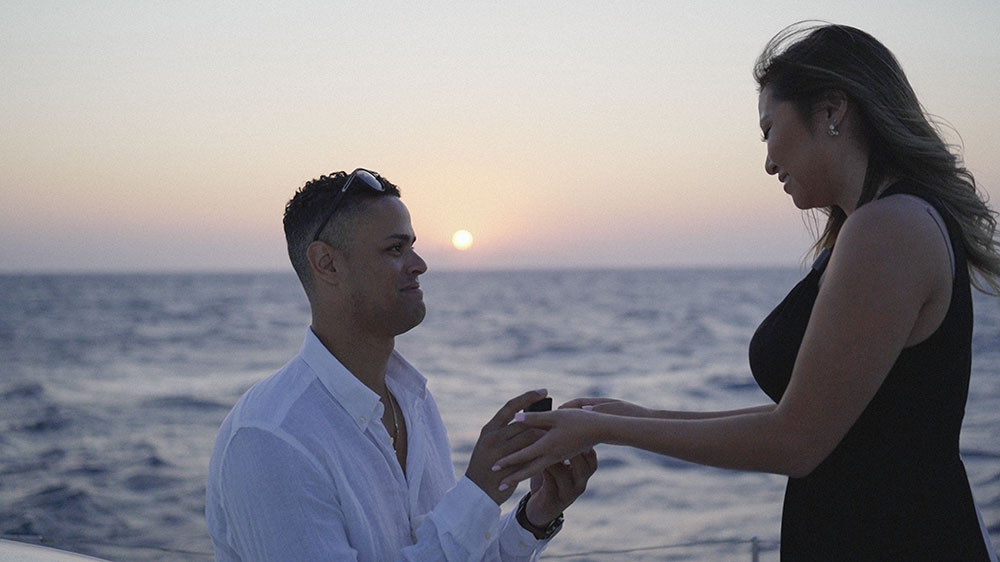 she said yes in santorini engagement boat sunrise sunset